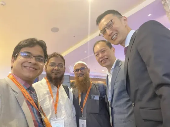 With colleagues at a conference